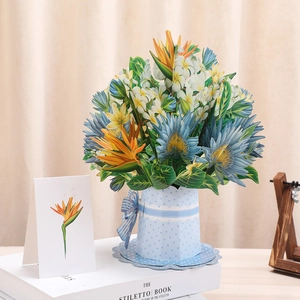 Detailed view of a 3D pop-up card featuring a vibrant floral bouquet in a blue polka dot vase
