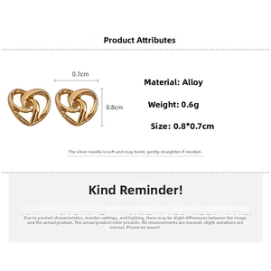 Detailed macro view of 0.8cm gold hollow heart stud earrings showing product dimensions