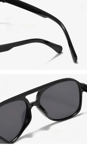 Detail of ergonomic curved legs and integrated nose pads for black retro aviator sunglasses