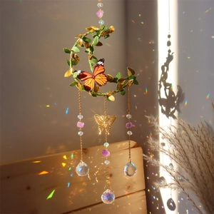 Moon-shaped sun catcher with crystal prisms, butterfly, and green leaves for garden decor