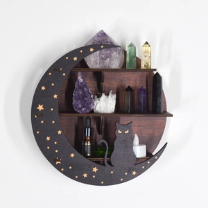 Detail of crescent moon wooden shelf with star cutouts and a black cat silhouette