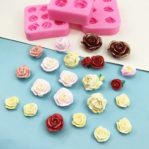 Pink silicone rose flower mold set for making multi-colored chocolates and fondant cakes
