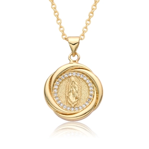 Detailed close-up of religious figure pendant with zircon inlay and gold plating
