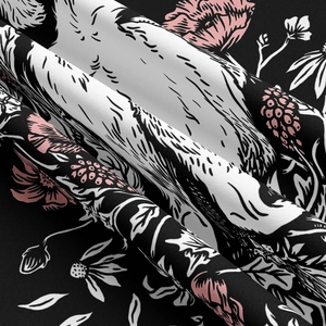 Detailed close-up of bohemian fabric showing high-quality cat and flower prints