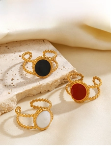 Three-piece gold plated stainless steel bead rings with enamel oval insets on silk