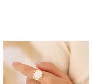 Minimalist 18K gold plated ring with a round white mother of pearl inlay on finger