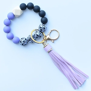 Purple leopard silicone bead wristlet keychain with wooden bead and faux leather tassel