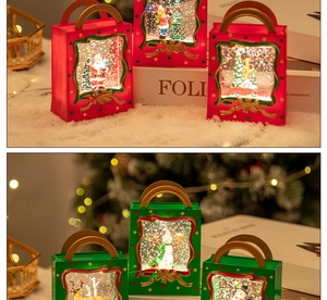 Close-up of Christmas water globe lantern with Santa Claus and snowman inside