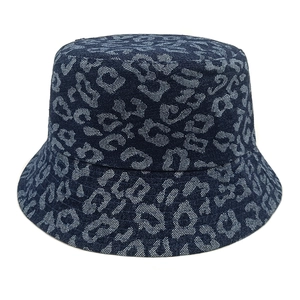Detailed close-up of dark blue leopard print denim bucket hat with sharp fabric texture