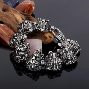 Detailed close-up of a silver lion head link bracelet with a rugged stainless steel finish