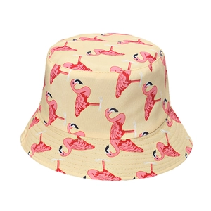 Detailed view of flamingo print bucket hat with beige fabric and pink patterns