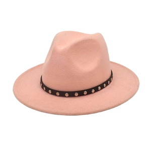 Close-up of pink wool fedora hat with black belt and silver stud rivet detailing