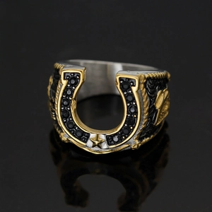 Vintage horseshoe ring in gold and silver steel with black zircon stones and star detail