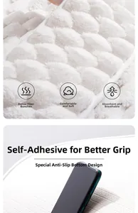 Detail of white memory foam bath mat featuring wavy texture and anti-slip backing surface