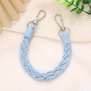 Close-up of a hand-woven light blue phone lanyard with polished silver metal clasps