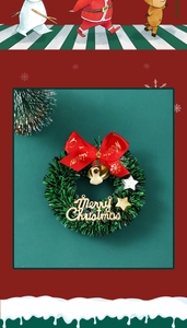 Mini Christmas star wreath with red bow, gold bell, and Merry Christmas sign detail