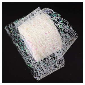 Close-up of white mesh ribbon with iridescent laser sequins for gift wrapping decoration