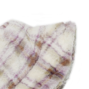 Close-up of soft faux fur texture with purple and brown plaid pattern on a bucket hat