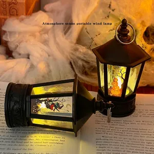 Halloween pumpkin lantern with LED light and witch illustration in a dark gothic setting
