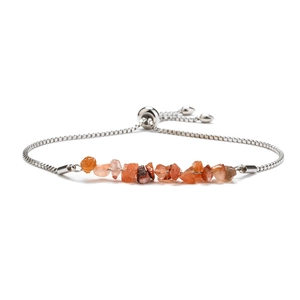 Detail of adjustable stainless steel box chain with natural orange quartz stone beads