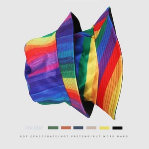 Detail showing the colorful rainbow patchwork pattern and fine stitching on the bucket hat