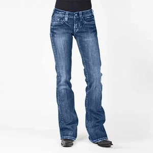 Detail view of dark blue flared jeans with washed whiskers and slim fit design