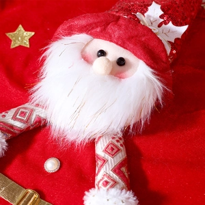 Close-up of Santa Claus chair cover with sequin details and embroidery for Christmas decor