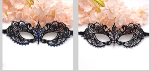 Close-up of lace masquerade masks with blue and purple rhinestones on a white background
