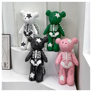 Detail view of gothic bear backpacks in four colors with skeleton embroidery and star patterns