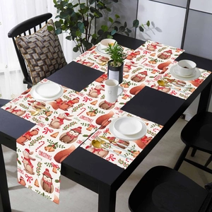 Detail view of festive Christmas table runner and placemats with hand-drawn animal patterns