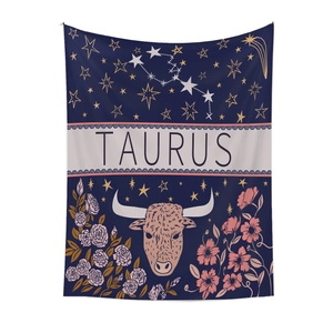 Close-up of Taurus zodiac tapestry featuring artistic bull illustration and floral details