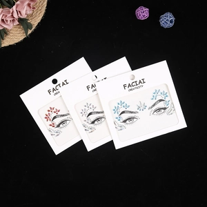 Three packs of self-adhesive face jewels in red gold blue and silver on black background