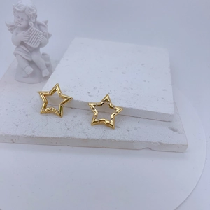 Detail of gold-plated hollow star earrings with micro-set sparkling zircons