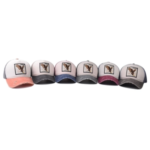Freedom eagle embroidered trucker hats with distressed details and breathable mesh in six colors