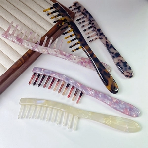 Premium wide-tooth acetate hair combs in four vintage marble patterns with long handles
