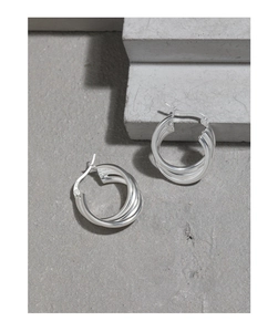 Detailed macro view of S925 sterling silver triple-layer interlocking hoop earrings