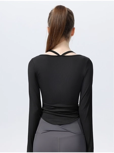 Detail view of back cross-strap design and V-shape waistband on slim fit yoga wear