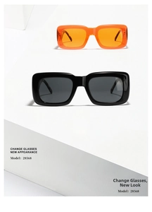 Detail shot of vintage square sunglasses in black and translucent orange on a white platform