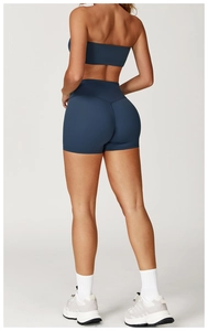 Rear view of tight navy yoga bra and high-waisted shorts set for fitness and sports