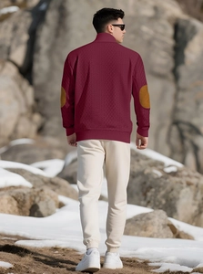Men's burgundy knit pullover with brown elbow patches and stand collar outdoor view