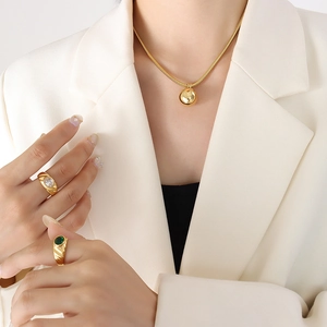 Gold plated snake chain necklace with sphere pendant and oval gemstone rings set