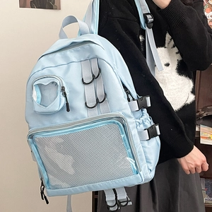 Light blue aesthetic backpack with heart-shaped window and mesh pocket for students