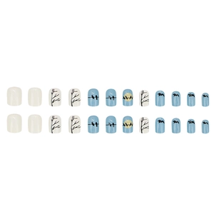 Blue sunset press-on nails with cute bird silhouettes and tree branch designs