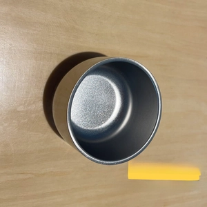 Close-up of 304 stainless steel lid with brushed finish used as a small portable cup