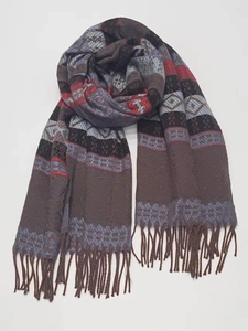 Detailed view of bohemian striped cashmere-feel scarf with geometric patterns and fringe tassels