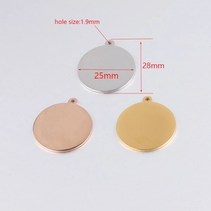 Polished stainless steel round blanks in gold and silver showing 25mm diameter scale