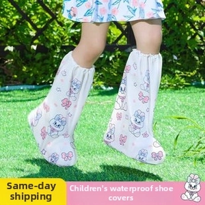 Detailed view of high-tube waterproof children shoe covers with cartoon rabbit patterns
