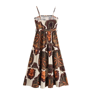 Detail view of ethnic print sundress featuring tiered skirt and pleated bodice design