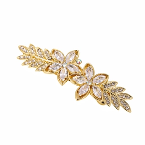 Elegant gold flower hair clip with pearls and sparkling zircon crystals on white background