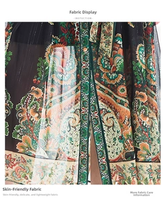 Close-up of lightweight fabric showing detailed bohemian paisley floral patterns